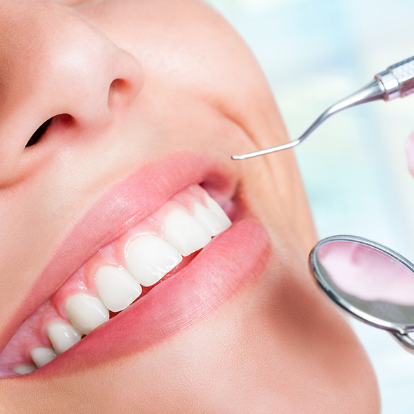girl with pretty smile at dentist office